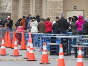 Shoppers line up to get into the Costco in Vaudreuil-Dorion April 10, 2020.