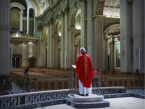 Archbishop Christian Lépine conducts Good Friday service in Mary Queen of the World Cathedral in Montreal Friday April 10, 2020.  Due to the coronavirus pandemic the service was held in the empty cathedral and broadcast on the web.