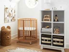 Natural elements such as wood, wicker and woven rugs help create a comfy and cosy hygge look in a child's room.  Handmade Water Hyacinth Bear Hamper, $99, CrateAndBarrel.com