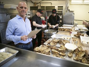 Moishes restaurant Lenny Lighter, left, oversees the making of meals for the Old Brewery Mission on Tuesday, April 14, 2020.