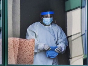 A worker pauses from wiping down furniture at Résidence Herron in Dorval on Wednesday. If only we’d invested proactively over the years in underfunded CHSLDs, Allison Hanes writes, perhaps the COVID-19 pandemic’s grim toll on the aged might have been lessened in Quebec.