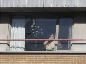 A resident at CHSLD Joseph-François Perrault looks out the window on April 16, 2020.