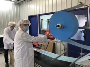 Production workers inside Entreprise Prémont's plant in Louiseville.