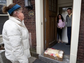 Karen Etingin drops off ingredients for her friend Clarence Epstein to make cheese sandwiches with his daughter Marlo to benefit Share the Warmth.