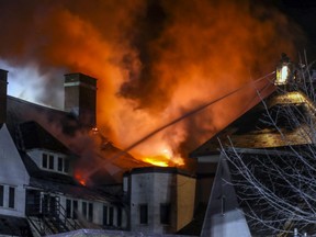Firefighters battle a five-alarm blaze at the Académie Ste-Anne private elementary school in Dorval on Sunday, April 26, 2020.