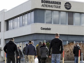 Workers return from lunch to the Bombardier plant on Marcel-Laurin Blvd.  in 2018.