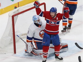 Canadiens' Brendan Gallagher celebrates his team's goal against Islanders goaltender Thomas Greiss during a game in December at the Bell Centre.