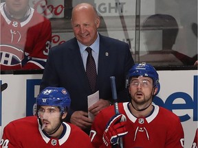 Montreal Canadiens head Claude Julien is all smiles following goal by Phillip Danault against the New York Islanders in Montreal on Dec. 3, 2019.