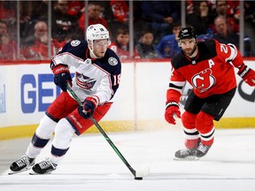 Columbus Blue Jackets' Pierre-Luc, left, Dubois looks for an opening as New Jersey Devils' Kyle Palmieri defends at the Prudential Center in Newark, N.J., on Feb. 16, 2020.