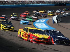 Joey Logano, driver of the #22 Shell Pennzoil Ford, and Alex Bowman, driver of the #88 Axalta Chevrolet, lead during the NASCAR Cup Series FanShield 500 at Phoenix Raceway on March 8, 2020 in Avondale, Ariz.