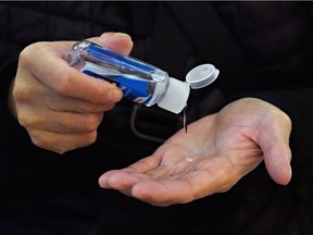 A commuter at Grand Central uses hand sanitizer as the coronavirus continues to spread across the United States on March 16, 2020 in New York City.