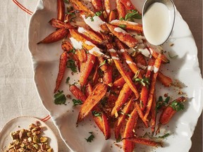 Roasted Carrots with Pistachios, Sumac and Yogurt-Lime Drizzle from All About Dinner by Molly Stevens. Cut them bite-size and be sure they are spread out so they roast, rather than steam.