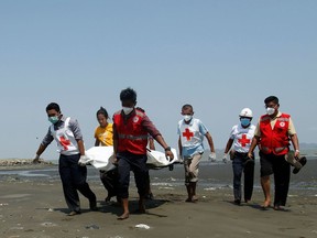 A Myanmar government health worker was injured and his driver killed when their United Nations-marked vehicle was ambushed as they were carrying COVID-19 test samples in conflict-ridden Rakhine state, the UN said April 21.