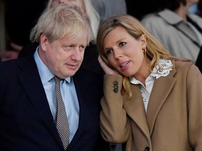 British Prime Minister Boris Johnson with his partner, Carrie Symonds on March 7, 2020.
