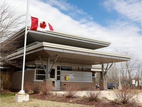 A memorial is seen at the bottom of the flag pole at the Bible Hill Royal Canadian Mounted Police (RCMP) Station, in Bible Hill, N.S., on Monday, April 20, 2020.