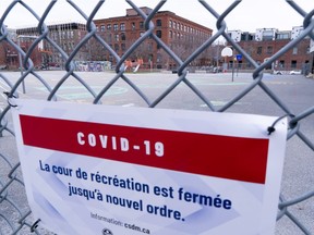 A closed schoolyard is seen through its fence in Montreal April 27, 2020.