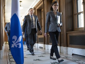 CP-Web. Quebec Health Minister Danielle McCann, right, and Quebec Premier Francois Legault walk to a daily news conference on the COVID-19 pandemic, Tuesday, March 31, 2020 at the legislature in Quebec City.