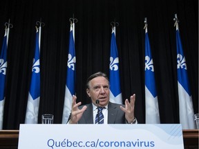 CP-Web. Quebec Premier Francois Legault responds to reporters during a news conference on the COVID-19 pandemic, Tuesday, March 31, 2020 at the legislature in Quebec City.