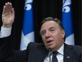Quebec Premier François Legault responds to reporters during a news conference on the COVID-19 pandemic, on Friday, April 10, 2020, at the legislature in Quebec City.