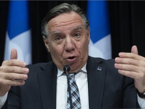 Quebec Premier François Legault speaks to reporters during a news conference on the COVID-19 pandemic on April 24, 2020 at the legislature in Quebec City.