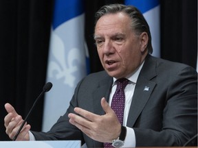 Quebec Premier François Legault announces his intention to re-open elementary schools in the province in May during a news conference on the COVID-19 pandemic at the legislature in Quebec City on April 27, 2020.