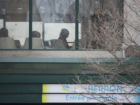 People are shown inside Maison Herron, a long term care home in the Montreal suburb of Dorval, Que., on Saturday, April 11, 2020, as COVID-19 cases rise in Canada and around the world.