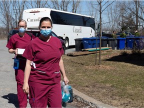 Canadian Armed Forces medical personnel arrive at Villa Val des Arbres, a seniors' long-term care centre in Laval, to help amid the outbreak of COVID-19, April 20, 2020.