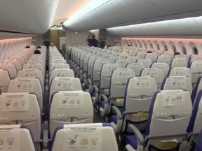 Empty seats during a flight from Singapore to Bangkok on March 4, 2020, in this screenshot obtained from social media video.