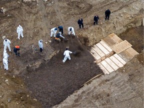 Drone pictures show bodies being buried on New York's Hart Island, where the Department of Corrections is dealing with more burials overall, amid the COVID-19 outbreak in New York City on Friday, April 9, 2020.