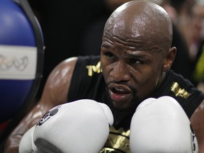 Boxer Floyd Mayweather Jr. goes through moves during a media workout at the Mayweather Boxing Club on Aug. 10, 2017, in Las Vegas.