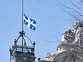 The Quebec flag flies at half-mast for the victims of a mass shooting in Nova Scotia, Monday, April 20, 2020 at the legislature in Quebec City.