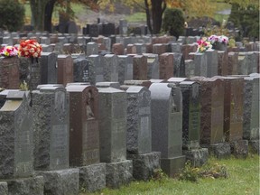 File photo of tombstones at Notre-Dame-des-Neiges cemetery. Burials at the cemetery are now suspended until further notice after two managers tested positive for COVID-19.