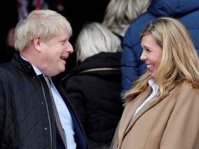 Britain's Prime Minister Boris Johnson with his partner, Carrie Symonds.