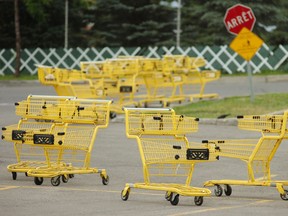 Shopping carts in the parking lot of a big-box store.