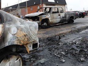 Two tow trucks caught fire at a towing company's parking lot on Creusot St. near the corner of Magloire St. in St-Léonard April 30, 2020.