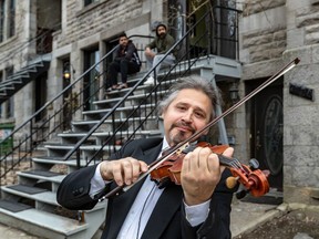 Souvenir Street Pavel Denisov decided to play for his neighbours on Easter Sunday in Montreal on Sunday April 12, 2020. Dave Sidaway / Montreal Gazette ORG XMIT: 64254