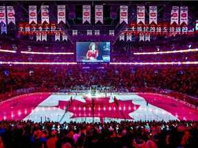 The Canadian flag is projected onto the ice at the Bell Centre during singing of the national anthem before NHL game between the Canadiens and the Florida Panthers in Montreal on Jan. 15, 2019.