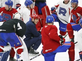 Laval Rocket head coach Joël Bouchard talks to his team during practice at Place Bell in Laval on Jan. 30, 2020.