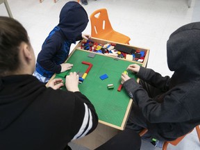 Kids and a daycare worker at the Dante school daycare on Tuesday March 17, 2020.