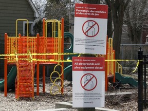 Signs block the entrance to a playground in Lachine April 1, 2020.