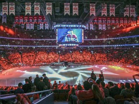 Canadiens fans watch light show prior to the start of Game 1 of the first round of the NHL playoffs against the New York Rangers in Montreal on April 12, 2017.