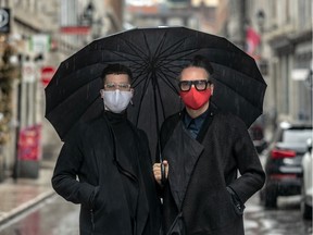 "They're more haut de gamme," designer Denis Gagnon says of his newly launched line of masks created in Montreal. He wears a red one, employee Martin Blais a starker version in white. Glitter and black velour are also sold.