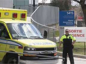 Ambulance technician waits outside the emergency ward of Maisonneuve Rosemont hospital on Sunday May 3, 2020.