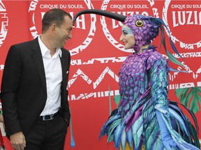 Mitch Garber meets a character from the show on red carpet before premiere of Cirque du Soleil's Luzia show on May 4, 2016 at Montreal's Old Port.