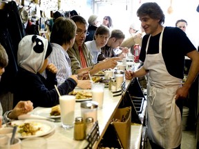 File photo from 2008 of diners cramming the counter at Cosmo’s restaurant in N.D.G., which earned a reputation for low prices, large portions, a seemingly endless supply of hash browns and complete lack of pretension.