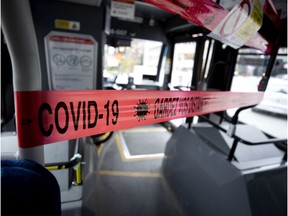 Tape restricts passengers from getting too close to STM bus drivers in Montreal May 4, 2020.