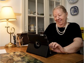 Carmela Campanelli writes emails on her iPad at her home in Montreal on Tuesday, May 5, 2020.