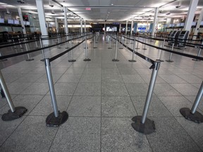 The near-deserted terminals at Trudeau airport are a stark reminder of the new normal.