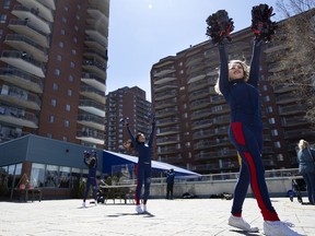 The Alouettes' cheerleaders perform at Au Fil De L'Eau Residence in Montreal on May 13, 2020.