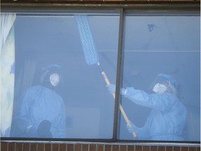 Cleaning personnel wash down and disinfect a room at CHSLD Vigi Mont-Royal on Thursday, May 14, 2020.
